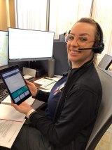 Adventist Health's Christianne Madrigal, RN, holding an IPAD while on duty in Hanford.
